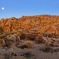 Setting Full Moon Over Teetering Rock Formation